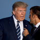 President Donald Trump, a confused and racist old man with a lukewarm dollop of moldy clam chowder where his brain should be, speaks with French President Emmanuel Macron at the G7 summit in France on August 25, 2019